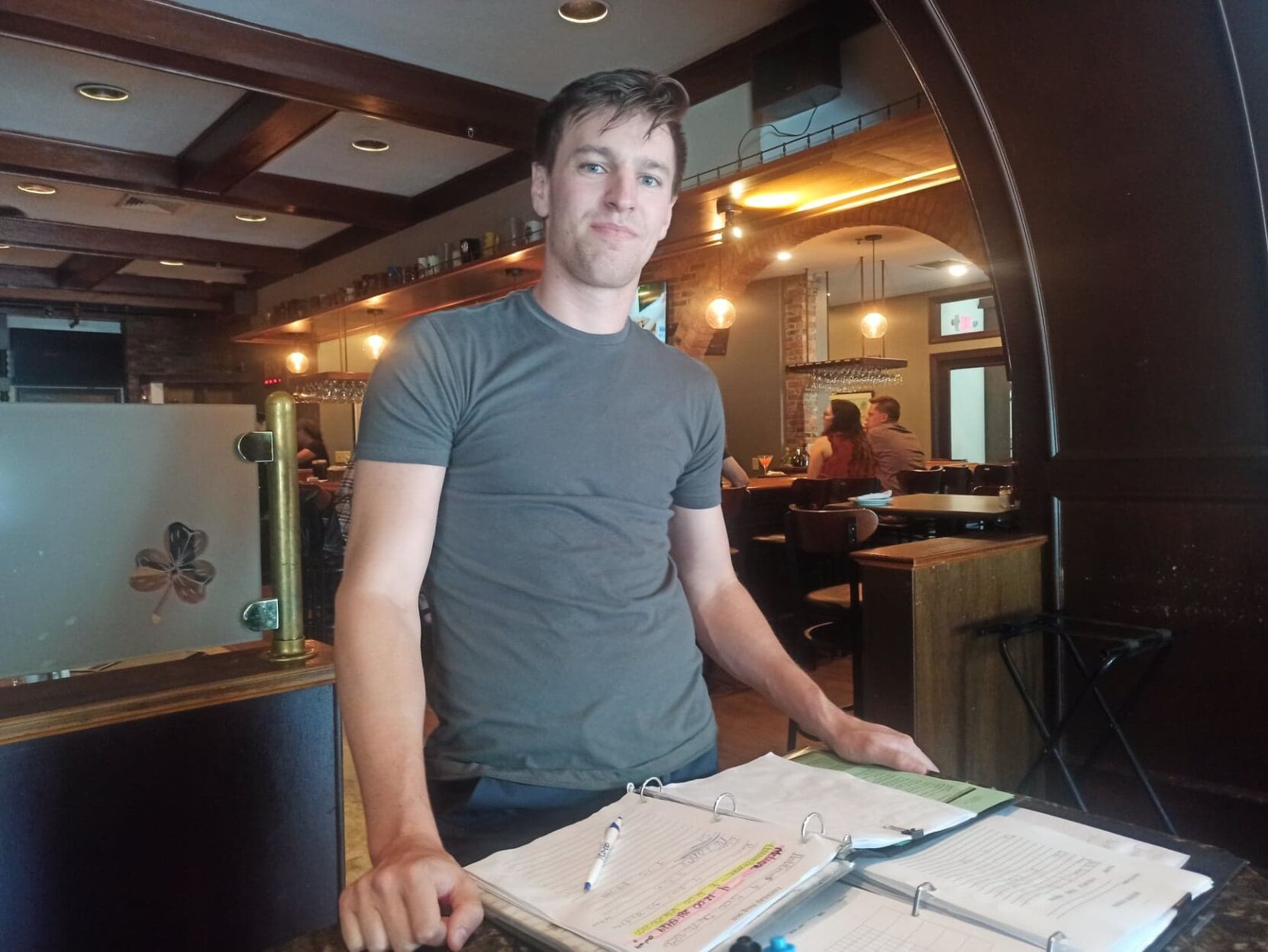 Man at host station in pub